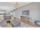 Cozy living room with modern decor flowing into a kitchen area and featuring stylish furnishings at 20837 N 23Rd Pl, Phoenix, AZ 85024