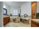 Elegant bathroom featuring a soaking tub, vanity area and neutral tile throughout at 22406 S 173Rd Way, Gilbert, AZ 85298