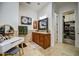 Bathroom featuring a wooden vanity, large mirror, and walk-in closet at 22406 S 173Rd Way, Gilbert, AZ 85298