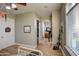 Neutral bedroom boasting wood floors, an ensuite bathroom, and ample natural light from the window at 22406 S 173Rd Way, Gilbert, AZ 85298