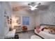 Brightly lit bedroom with a daybed, accent chair and decorative wallpaper at 22406 S 173Rd Way, Gilbert, AZ 85298