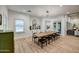 Dining area with a large table, stylish chandelier, and built-in cabinets at 22406 S 173Rd Way, Gilbert, AZ 85298