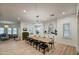 Bright dining room features a large wooden table with seating for ten at 22406 S 173Rd Way, Gilbert, AZ 85298