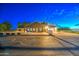 Rear view of a single story home with a large parking area and an outdoor structure at 22406 S 173Rd Way, Gilbert, AZ 85298