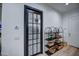 Hallway with decorative door leading to kitchen and decorative shelving on the side at 22406 S 173Rd Way, Gilbert, AZ 85298