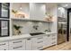 Close-up of kitchen featuring sleek countertops, cooktop, and white cabinetry at 22406 S 173Rd Way, Gilbert, AZ 85298