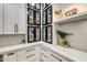 Elegant kitchen with glass-front cabinets displaying dishware and stylish decor at 22406 S 173Rd Way, Gilbert, AZ 85298