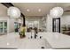 Open floor plan view from kitchen island into the living room featuring modern decor at 22406 S 173Rd Way, Gilbert, AZ 85298