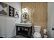 Stylish powder room featuring a wood accent wall, patterned floor tiles, and modern fixtures at 22406 S 173Rd Way, Gilbert, AZ 85298