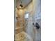 Walk-in shower featuring tile surround, a bench, and modern fixtures at 22406 S 173Rd Way, Gilbert, AZ 85298