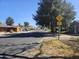 Street view of a neighborhood street with a speed hump sign and residential houses at 2423 E Flower St, Phoenix, AZ 85016