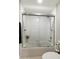 Bright, tiled shower and bathtub combo with glass door at 25821 S Hollygreen Dr, Sun Lakes, AZ 85248