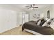 Spacious bedroom with natural light, showcasing closet space and calming color palette at 25821 S Hollygreen Dr, Sun Lakes, AZ 85248