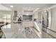 Well-lit kitchen with stainless steel appliances and island with granite countertop at 25821 S Hollygreen Dr, Sun Lakes, AZ 85248