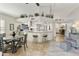 Bright, airy kitchen featuring a large island, modern stainless steel appliances, and an adjacent dining area at 25821 S Hollygreen Dr, Sun Lakes, AZ 85248