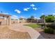 Spacious backyard featuring decorative rock, artificial grass, and concrete at 25845 W Lynne Ln, Buckeye, AZ 85326