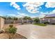 Backyard features a patio with stone flooring and desert landscaping at 25845 W Lynne Ln, Buckeye, AZ 85326