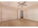 Bedroom with carpet, ceiling fan and walk-in closets at 25845 W Lynne Ln, Buckeye, AZ 85326