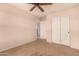 Bedroom showcasing double door closet, plush carpeting and neutral paint at 25845 W Lynne Ln, Buckeye, AZ 85326