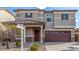 Frontal home exterior view displaying desert landscaping, a covered porch, and an attached garage at 25845 W Lynne Ln, Buckeye, AZ 85326