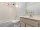 Bright bathroom with a white tub and shower combination at 26632 S Branchwood Ct, Sun Lakes, AZ 85248