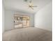 Bright bedroom featuring a ceiling fan and sliding glass door to outdoor space at 26632 S Branchwood Ct, Sun Lakes, AZ 85248