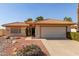 Charming single-story home with a desert-landscaped front yard and a two-car garage at 26632 S Branchwood Ct, Sun Lakes, AZ 85248