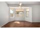 Bright, open living room featuring hardwood floors and a large bay window for lots of natural light at 26632 S Branchwood Ct, Sun Lakes, AZ 85248