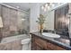 Stylish bathroom boasting granite countertops, a glass shower enclosure, and ample natural light at 28503 N 104Th Way, Scottsdale, AZ 85262