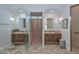 Elegant bathroom with dual sinks, walk-in shower, decorative tile, and plenty of vanity storage at 28503 N 104Th Way, Scottsdale, AZ 85262