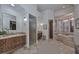 Bright primary bathroom featuring dual sinks, walk-in shower, and separate soaking tub with large windows at 28503 N 104Th Way, Scottsdale, AZ 85262