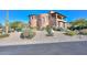 Stunning two-story stucco home featuring a barrel tile roof and desert landscaping at 28503 N 104Th Way, Scottsdale, AZ 85262