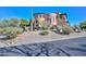 Stunning two-story stucco home featuring a barrel tile roof and desert landscaping at 28503 N 104Th Way, Scottsdale, AZ 85262