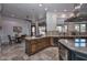 Well-appointed kitchen with island, breakfast area, and stone flooring at 28503 N 104Th Way, Scottsdale, AZ 85262