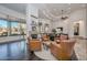 Inviting living room with leather chairs and a fireplace, offering a cozy and sophisticated space at 28503 N 104Th Way, Scottsdale, AZ 85262