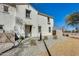 Inviting townhouse with drought-resistant landscaping, stucco facade, and charming architectural details at 2868 E Dunbar Dr, Phoenix, AZ 85042