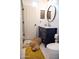 Modern bathroom with subway tile, marble countertop, and navy blue vanity with gold hardware at 29902 N 71St Ave, Peoria, AZ 85383