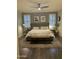 Serene main bedroom with hardwood floors, plantation shutters, and a neutral color palette at 29902 N 71St Ave, Peoria, AZ 85383