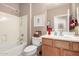 Bright bathroom features a tub/shower combo and a vanity with a framed mirror at 29986 N Jillian Dr, San Tan Valley, AZ 85143