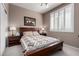 Relaxing bedroom featuring a comfortable bed, side tables, and natural light from the window at 29986 N Jillian Dr, San Tan Valley, AZ 85143