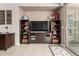 Living room with a media center, decor, and tile floors, creating a cozy and functional living space at 29986 N Jillian Dr, San Tan Valley, AZ 85143