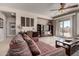 Comfortable living room with tile floors and a ceiling fan, perfect for relaxing and entertaining guests at 29986 N Jillian Dr, San Tan Valley, AZ 85143