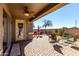 Relaxing covered patio featuring ceiling fan, brick pavers, and seating area at 29986 N Jillian Dr, San Tan Valley, AZ 85143