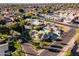 Residential homes amidst lush palm trees, complemented by community swimming pools at 302 W Stella Ln, Phoenix, AZ 85013