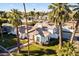 Aerial view of a home with a well-maintained lawn, mature trees, and inviting curb appeal at 302 W Stella Ln, Phoenix, AZ 85013