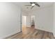 A bedroom with wooden floors, and doorway access to a walk-in closet and a doorway to another room at 302 W Stella Ln, Phoenix, AZ 85013