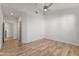 Spacious bedroom with contemporary ceiling fan and beautiful wood flooring at 302 W Stella Ln, Phoenix, AZ 85013