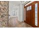 Elegant foyer with stone accents, hardwood floors, and an open view into the home at 302 W Stella Ln, Phoenix, AZ 85013