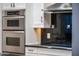 Detail of the kitchen cooktop and stainless steel microwave at 302 W Stella Ln, Phoenix, AZ 85013