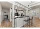 Bright open floor plan kitchen with stainless appliances and light wood floors at 302 W Stella Ln, Phoenix, AZ 85013